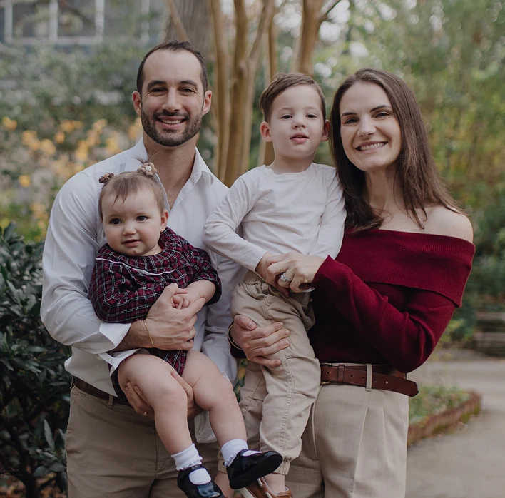 Atlanta personal injury attorney Jonathan Flack (left) with his family