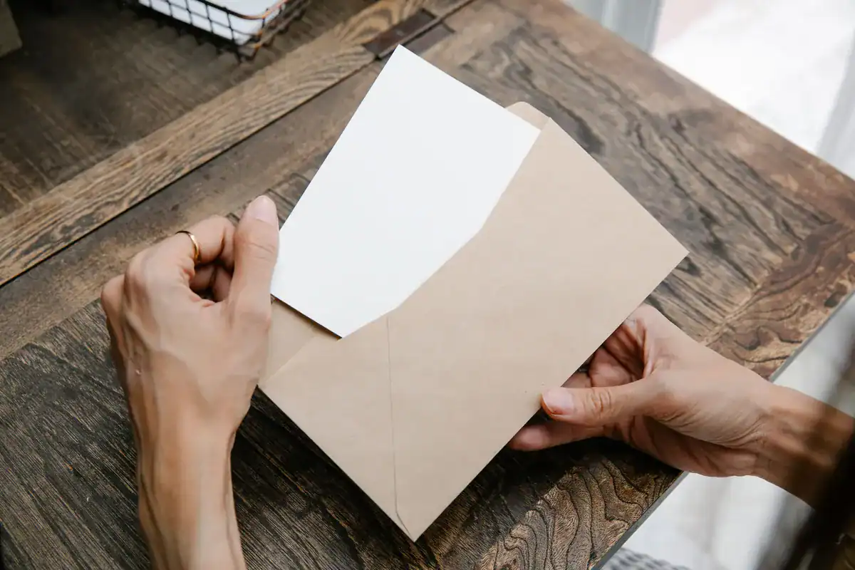Georgia injury client opening settlement paperwork after signing a release