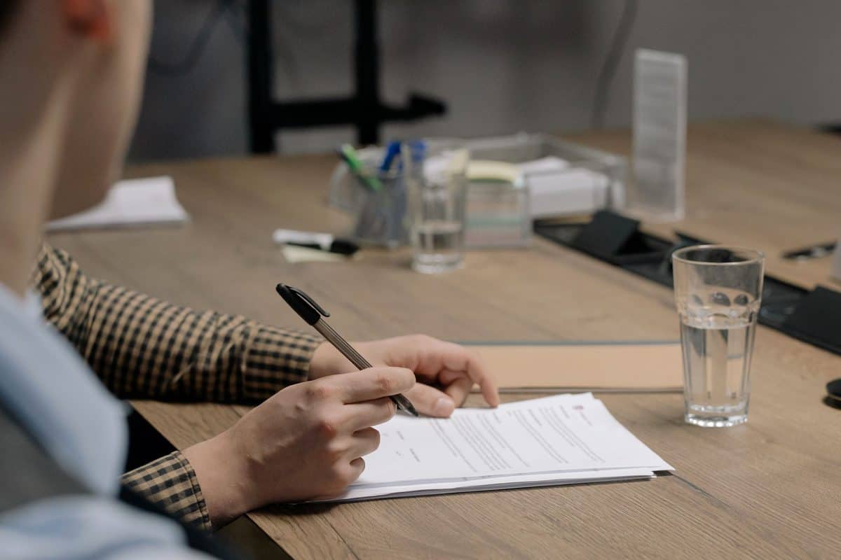 Person reviewing a Georgia car accident settlement release document before signing